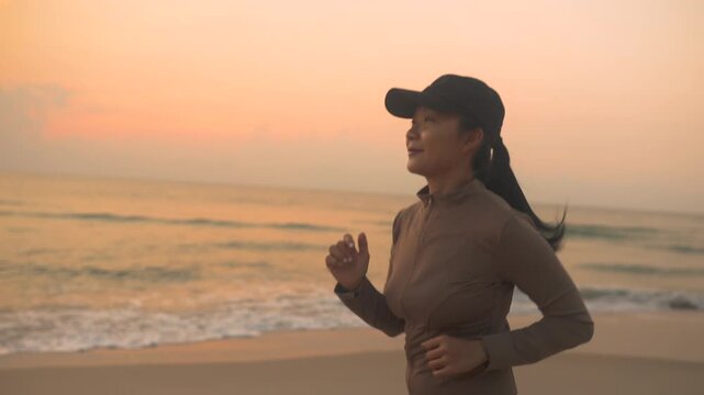 Woman running along a peaceful seaside at sunset, enjoying freedom and movement by the ocean, capturing a healthy lifestyle, outdoor exercise, summer vacation, travel, and wellness inspiration.
