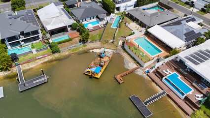 Aerial View of Canal Construction Barge in Broadbeach Waters Neighborhood © blueringmedia