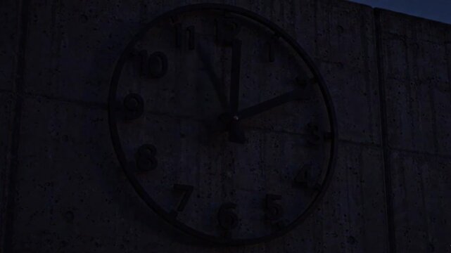 Time lapse close up of analog clock face on concrete wall, spinning hands, moving shadows, warm daylight to blue twilight, concept of time passing

