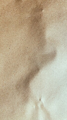Fototapeta premium Close up of brown handmade recycled paper texture with unique organic fiber swirl pattern.