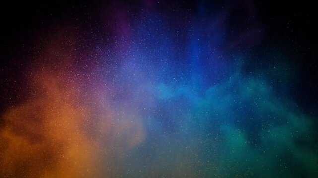 Slow-motion explosion of colorful powder colliding in mid-air against a black screen.