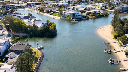 Aerial View of Luxury Waterfront Homes Along a Gold Coast Canal © blueringmedia