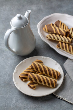 Traditional Diplogemisto and Esron striped cookies with cocoa filling, also known as Landose or Baston biscuits