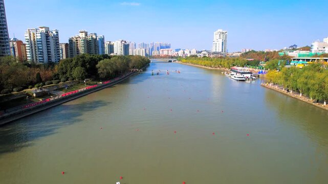 Dragon Boat Race on Urban River with City Skyline
