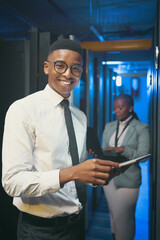 Happy, tablet and portrait of black man in server room for IT support, cybersecurity and...