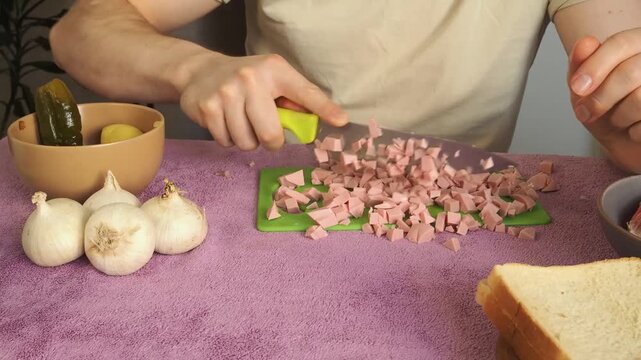 a man cutting ham for breakfast
