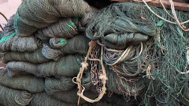 Huge Pile of Green Fishing Nets Close-Up