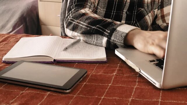 Focused and concentrated guy student e learning online on internet website. 