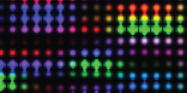 Vibrant multicolored led light display on a dark background with rows of glowing dots