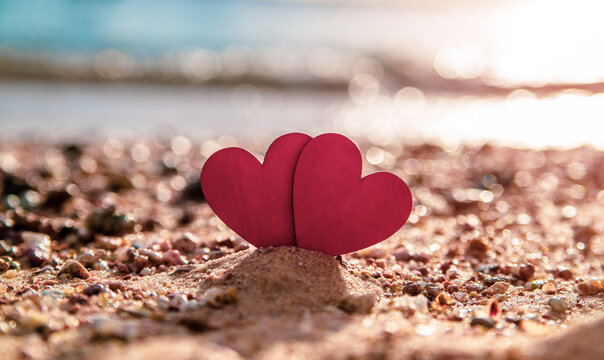 romantic symbol of two hearts on the beach