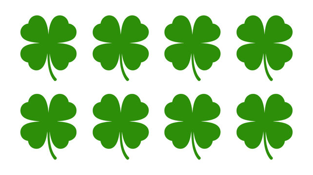 Eight green four leaf clover silhouettes against a white background lucky charm design high quality professional