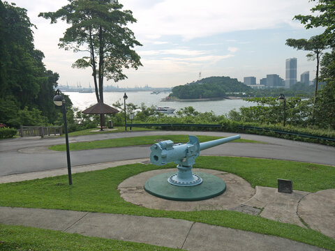 Fort Siloso on Sentosa Island scenery with old cannon and Singapore cityscape in background