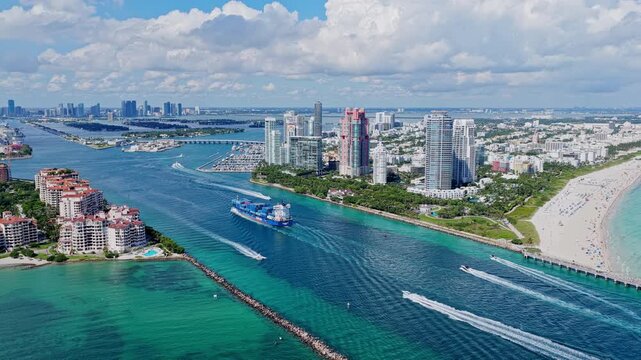 Miami, Florida, USA - March 31, 2026: Shipping logistics. Commercial shipping. Cargo ship in sea. Freight container loaded on cargo vessel. Aerial cargo ship in Miami. Cargo business. Container ship