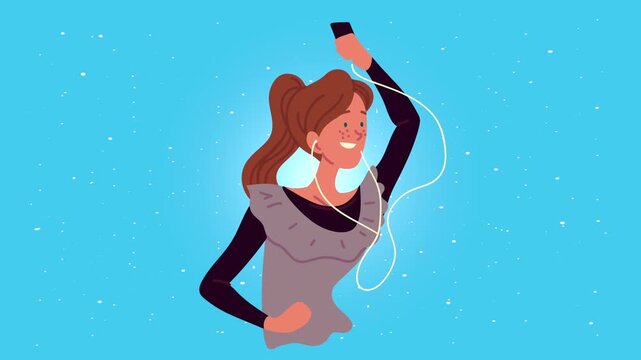 Young happy woman listening to music and dancing with smartphone and earphones on blue background.