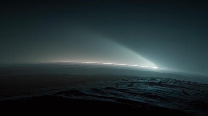 Fototapeta premium Distant saturn's rings creating a glowing line across the dark space horizon, seen from a dark extraterrestrial moon surface, with light beams catching atmospheric haze