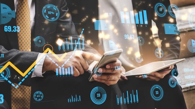 Two business professionals engage with digital devices amidst stylish financial visuals. The image captures the essence of data analysis in a modern office environment. Xenic