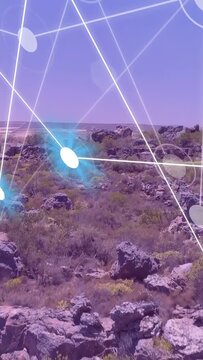 Vertical video: AR grid appearing, camera pulling back and tilting, revealing rocky outcrop mapping