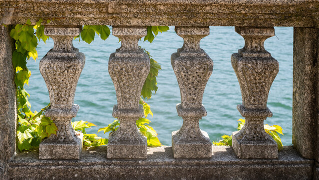 background with detail of a stone fence on lake Como, Italy