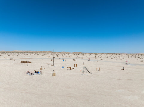 Aerial view of a desolate desert playground and picnic area