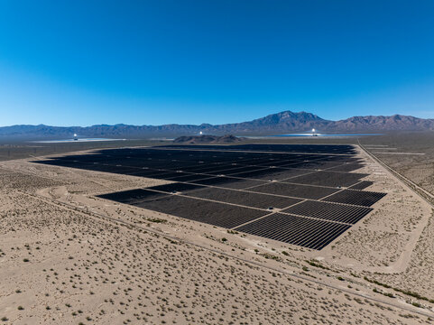 High angle large-scale solar farm in desert landscape