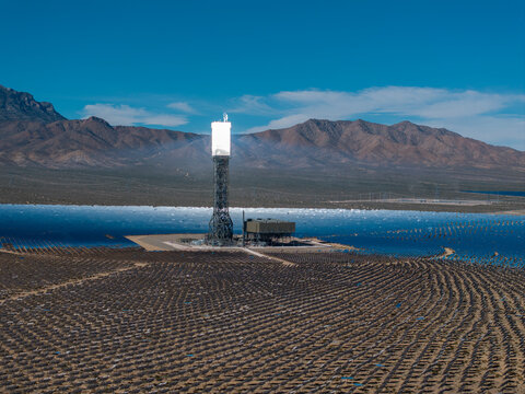 Aerial shot of solar receiver tower glowing thermal energy