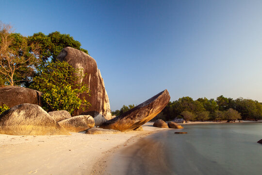 The beauty of a beach with white sand and large rocks on Belitung Island