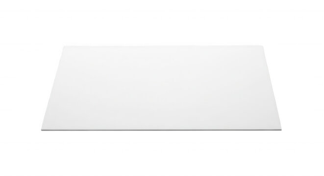 A rectangular white sheet of paper or flat board isolated on a solid black background viewed from a slightly elevated perspective