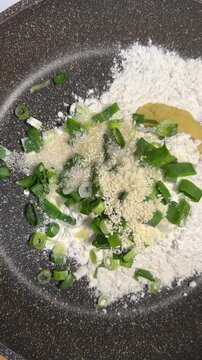 Pouring Flavor Seasoning into Pan for Sempol Batter top view
