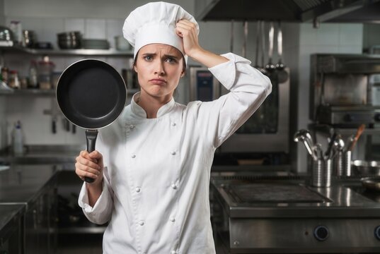 Confused female chef feeling frustrated, forgetting something important while working in a professional kitchen