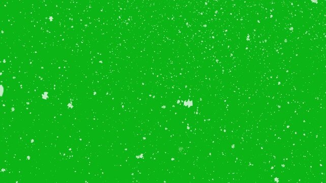 White snowflakes falling on vibrant green background suitable for winter themed designs, greeting cards, holiday season graphics, Christmas illustrations, festive backgrounds