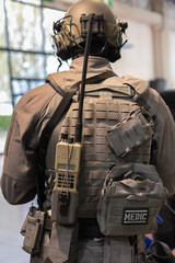 Fototapeta premium Back Of Soldier Showing Helmet Radio And Medical Equipment
