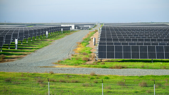 A large-scale solar power plant along the highway. California. USA.