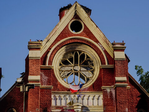 Close-up view of the fire-damaged facade and broken rose window of the historic San Borja Church (former chapel of San Borja Hospital) in Santiago, Chile, a structure destroyed in 2020.