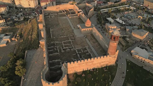 Erzurum, Turkey - 20th august, 2025: Aerial of Erzurum Castle interior: stone ramparts, red-brick tower, courtyard archaeological ruins at golden hour; Byzantine origins with later Seljuk - Ottoman