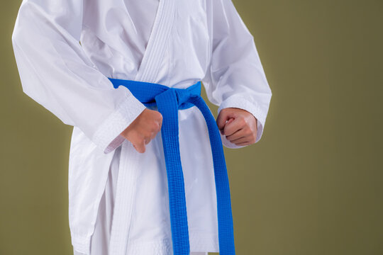 Boy standing in Heisoku Dachi with feet together and hands at sides. Shows precision, calm alignment, and disciplined martial arts foundation.