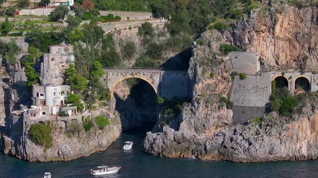Aerial Shot of Fiordo di Furore, Fjord of Furore. Azure Water, Cliffs, Big Canyon, famous bridge in Amalfi coast, Italy