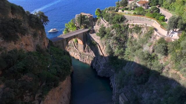 Aerial Shot of Fiordo di Furore, Fjord of Furore. Azure Water, Cliffs, Big Canyon, famous bridge in Amalfi coast, Italy