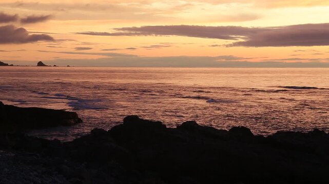 Sunset over the East China Sea with rocky coast in Amami Oshima, Japan