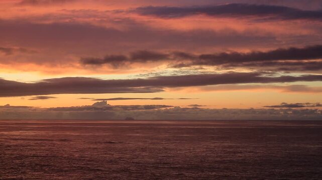 Sunset over the East China Sea with rocky coast in Amami Oshima, Japan
