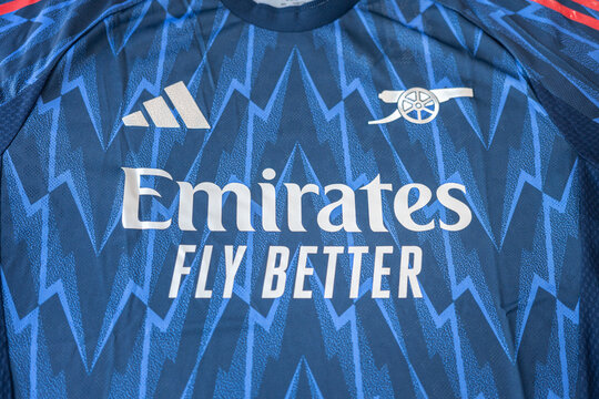 Bangkok, Thailand - 7 May 2026; Adidas is present the Arsenal FC away team jersey for season 2025-2026. It coming in deep blue color with thunderbolt pattern and metallic silver emblem. Close-up.