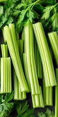 Obraz premium Vibrant Green Leafy Celery Stalks and Freshly Cut Raw Celery for Healthy Vegan Diet Imagery