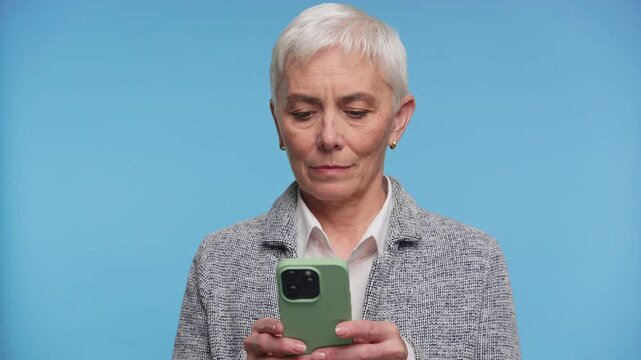 Senior Woman Typing Message on Smartphone