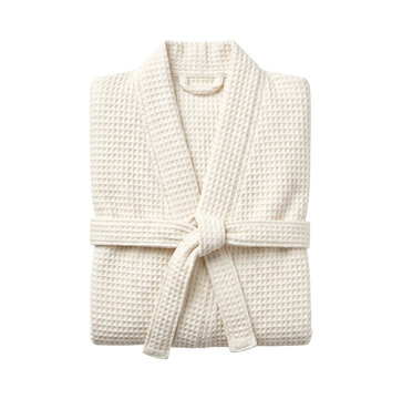 Folded white waffle weave bathrobe with belt isolated. Spa and hotel apparel.