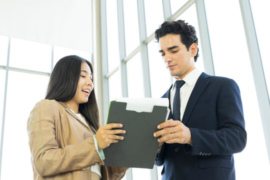 Young business people are shaking hands after a business deal. Successful negotiations or interview.
