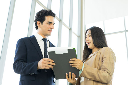 Young business people are shaking hands after a business deal. Successful negotiations or interview.
