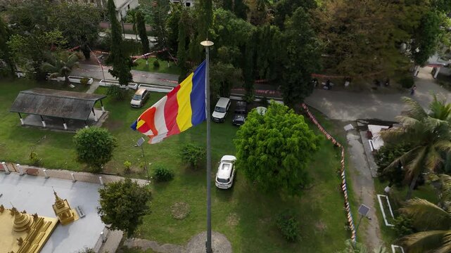 Aerial shot of the Buddhist flag waving at Golden Pagoda, Namsai, Arunachal Pradesh.