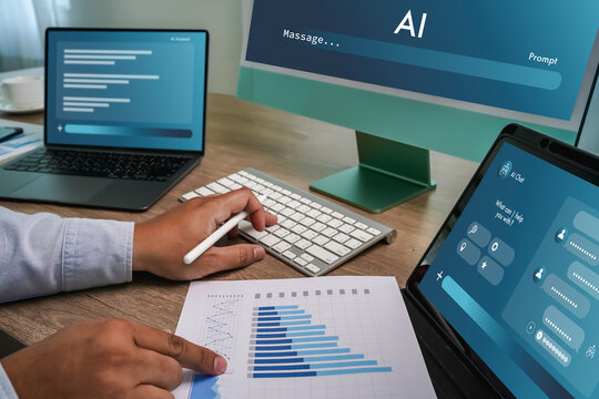 Hand using keyboard and tablet displaying AI interface with data chart document on desk, representing AI data analysis workflow, machine learning processing, reporting system, and digital business ana