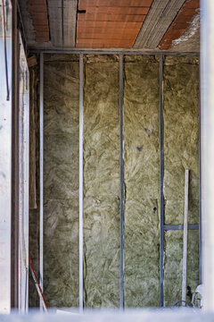 Building insulation showing rockwool panels and metal studs