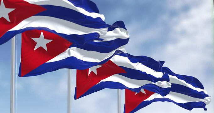 Cuban flags with iconic blue, white, and red stripes, and a white star on a red triangle, Seamless 3d render animation. Slow motion loop. Selective focus illustration.