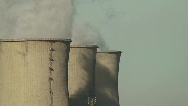 nuclear power plant Smokestacks of factory tubes chimney smoke create environmental pollutants Factory tubes chimney smoke